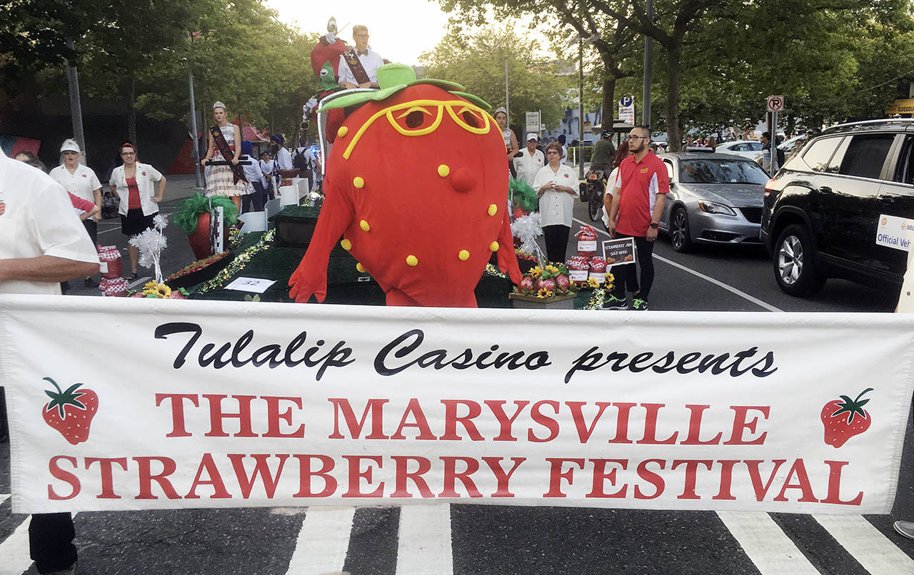 The Marysville Strawberry Festival was represented at the Seafair Torchlight Parade in Seattle on July 28. (Sue Misao / The Herald)