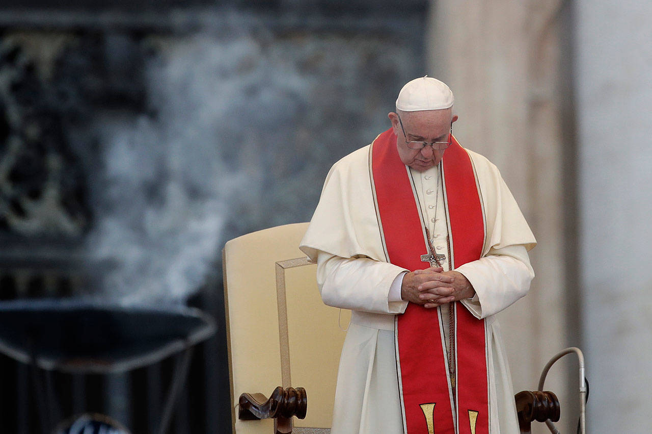 Pope Francis prays during an audience in St. Peter’s square at the Vatican on July 31. The Vatican said Aug. 2, that Pope Francis has changed church teaching about the death penalty, saying it can never be sanctioned because it attacks the inherent dignity of all humans. (Alessandra Tarantino/Associated Press)