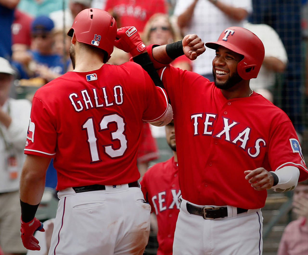 Texas’ Joey Gallo is congratulated by teammate Elvis Andrus after hitting a home run during the third inning of a Wednesday’s game in Arlington, Texas. (AP Photo/Mike Stone)