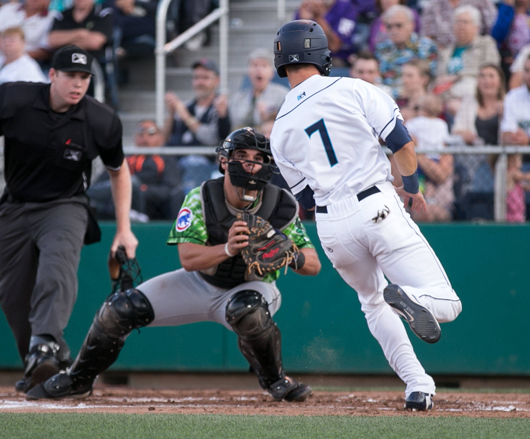 AquaSox’s Ryan Ramiz is tagged out by Emeralds’ Caleb Knight on Friday night at Everett Memorial Stadium in Everett on Aug. 10, 2018. (Kevin Clark / The Herald)