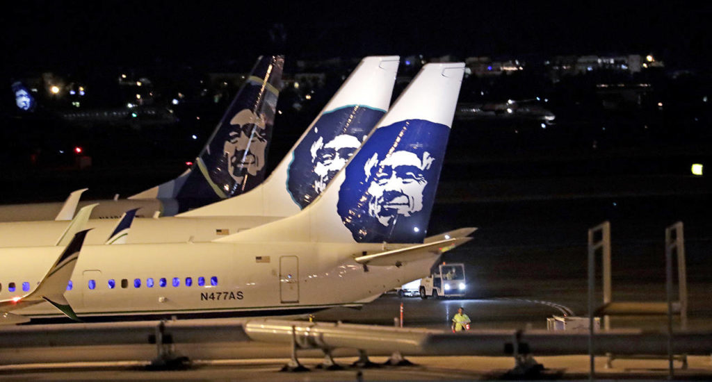 Alaska Airlines planes sit on the tarmac at Sea-Tac International Airport on Friday evening, Aug. 10, in SeaTac. (AP Photo/Elaine Thompson)
