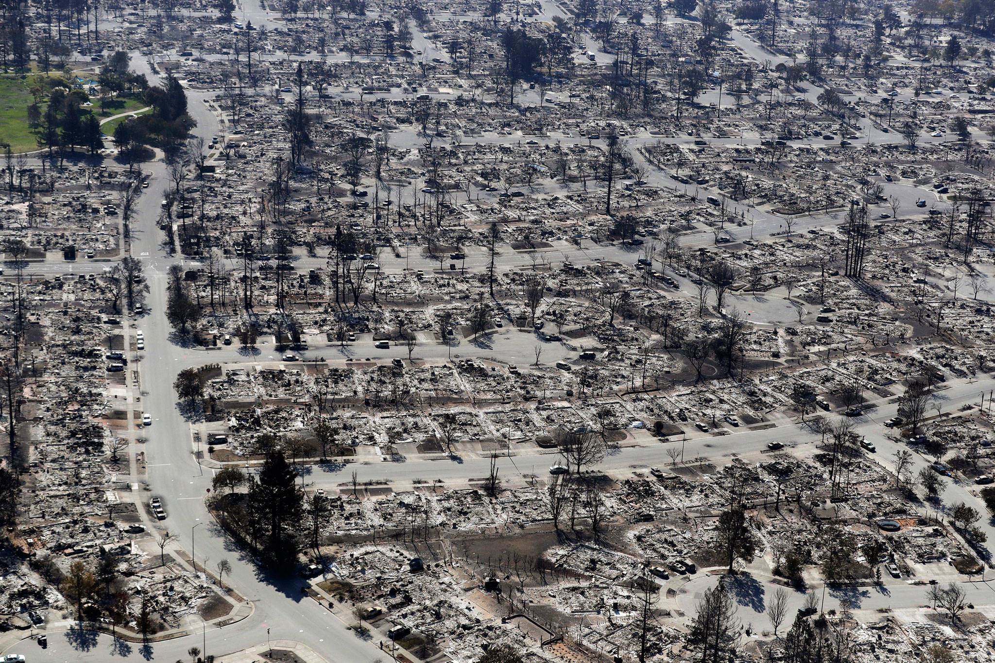 In this Oct. 2017, photo, an aerial view shows the devastation of the Coffey Park neighborhood after a wildfire swept through in Santa Rosa, California. (AP Photo/Marcio Jose Sanchez, File)