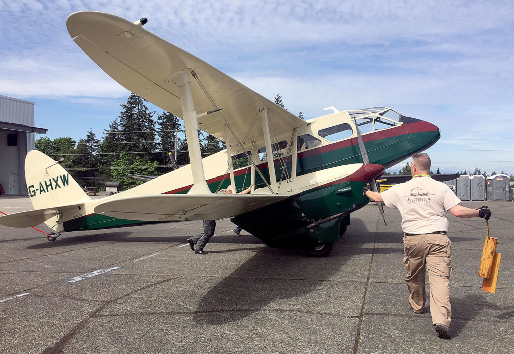 Volunteers at the Historic Flight Foundation wheel out the de Havilland Dragon Rapide in 2017. (Herald file)
