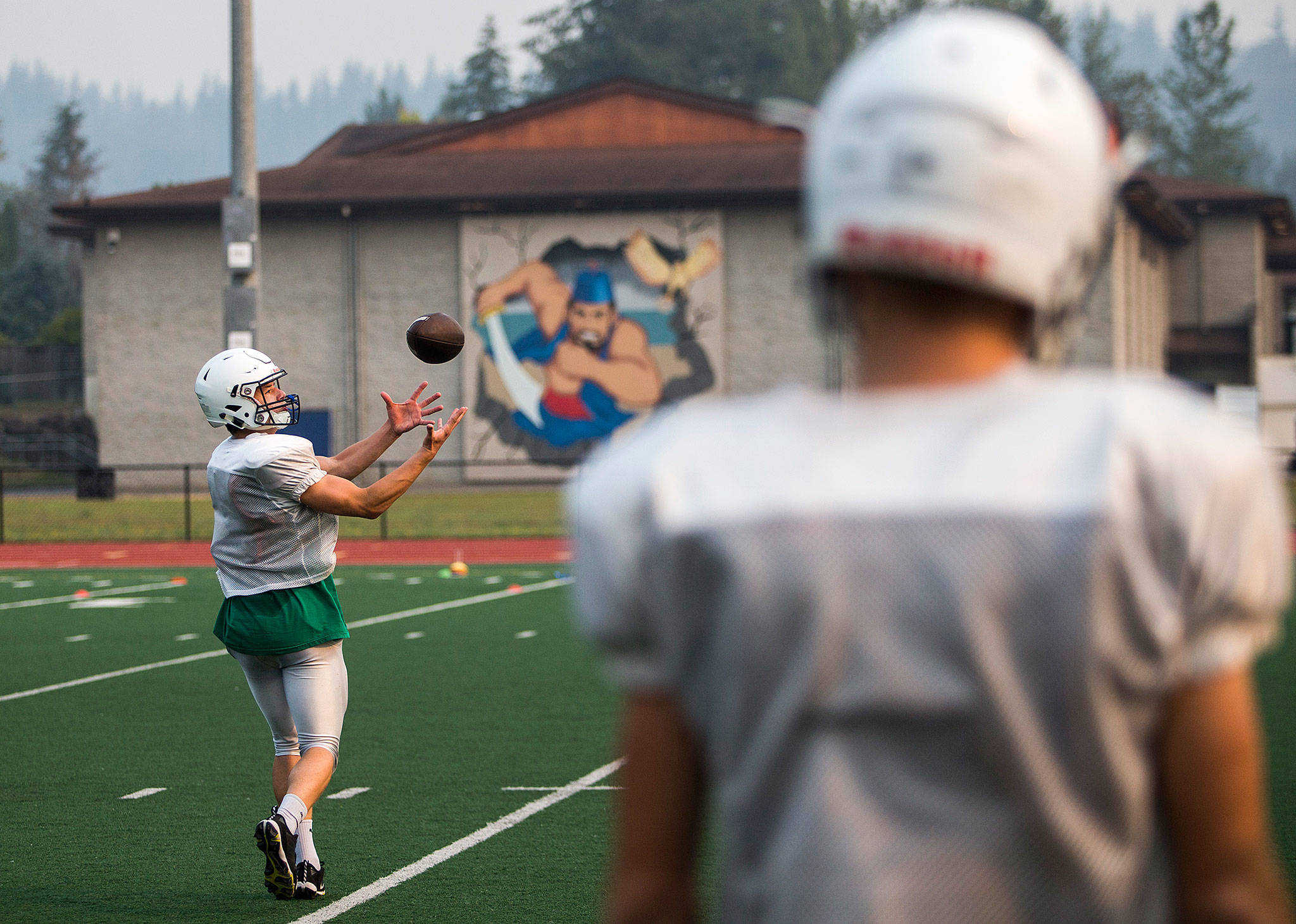 Obed Cushing catches a pass during Sultan High School’s Aug. 22 football practice. (Olivia Vanni / The Herald)