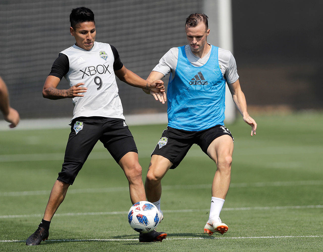 Seattle’s Brad Smith (right) defends Raul Ruidiaz (9) during a Sounders training session on Aug. 8 in Tukwila. Smith was acquired on loan from Bournemouth in the English Premier League earlier this month. (AP Photo/Ted S. Warren)