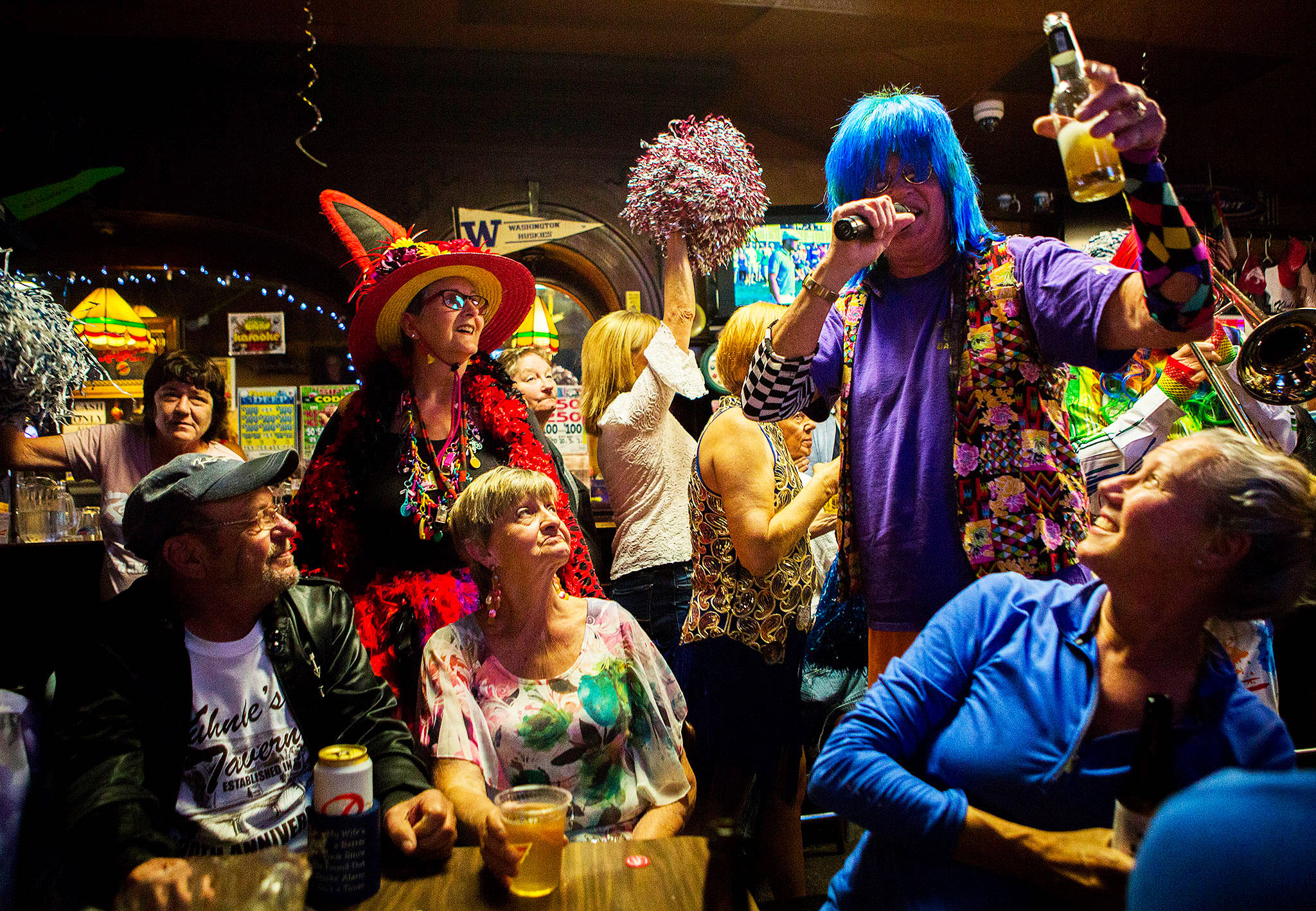 Gordon Taylor of the Sauerkraut Band tells patrons to raise their drinks during the Kuhnle’s Tavern 100th year celebration Saturday in Marysville. (Olivia Vanni / The Herald)