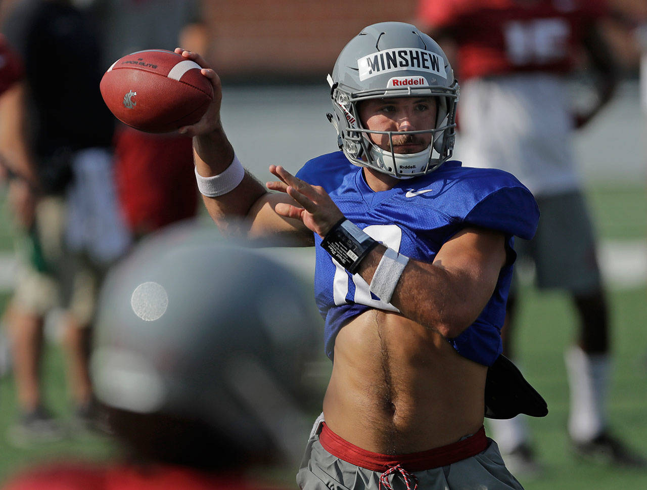 Washington State quarterback Gardner Minshew passes during a practice last week in Pullman. Minshew is one of three quarterbacks competing for the starting job. (AP Photo/Ted S. Warren)