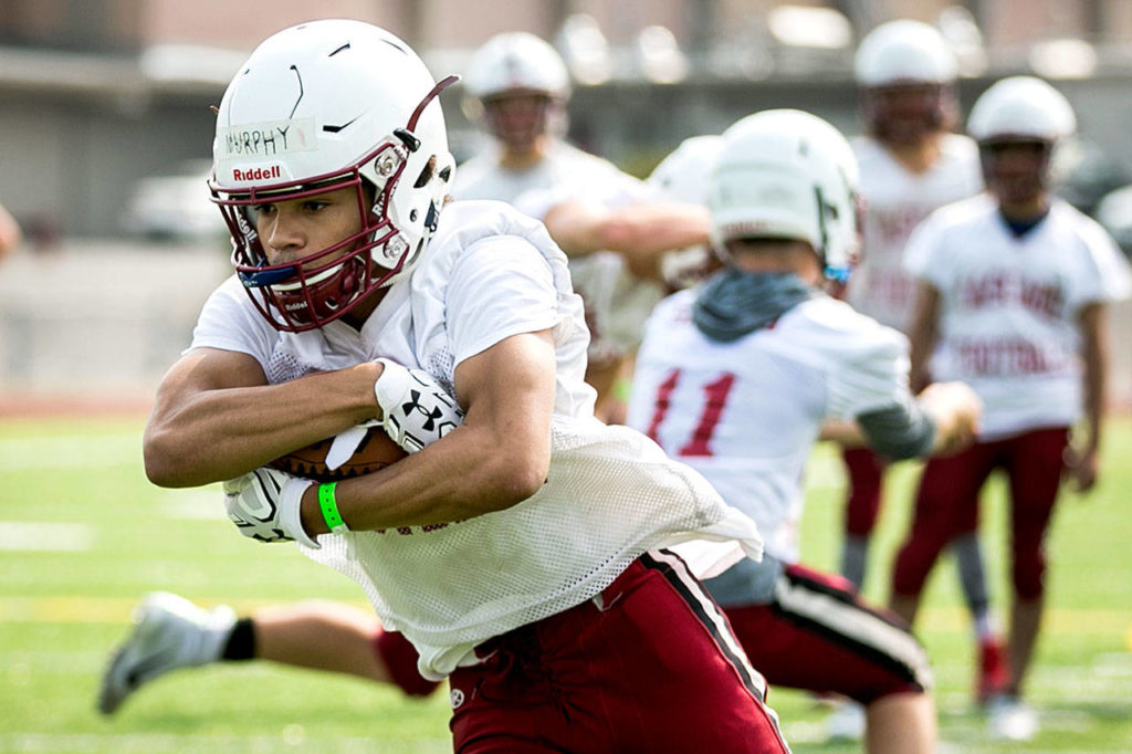 Cascade’s Davanta Murphy runs through a play during a Thursday practice session at Cascade High School. (Kevin Clark / The Herald)
