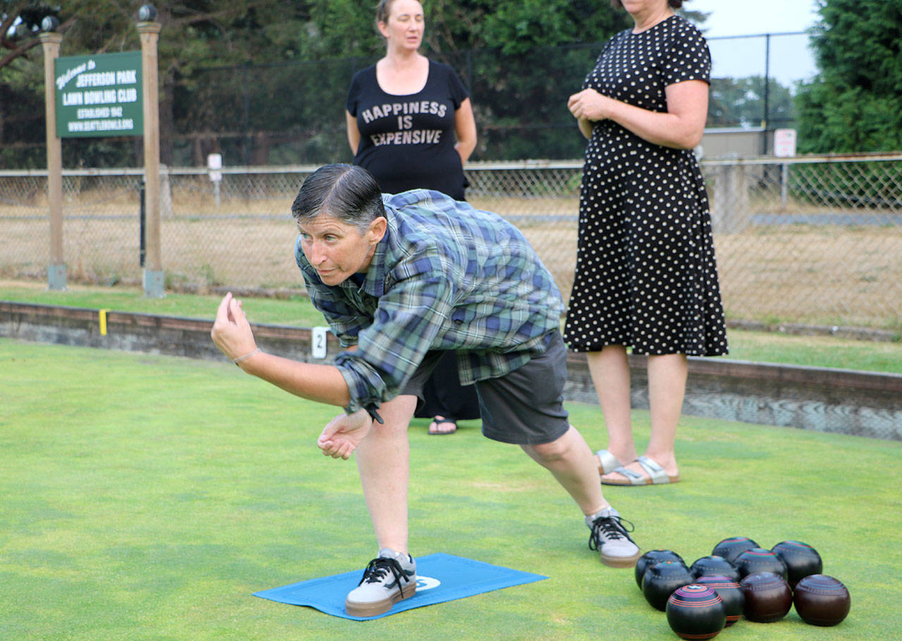 Tina Thomas of Lynnwood competes in lawn bowling recently at Jefferson Park in Seattle. (Nick Patterson / The Herald)