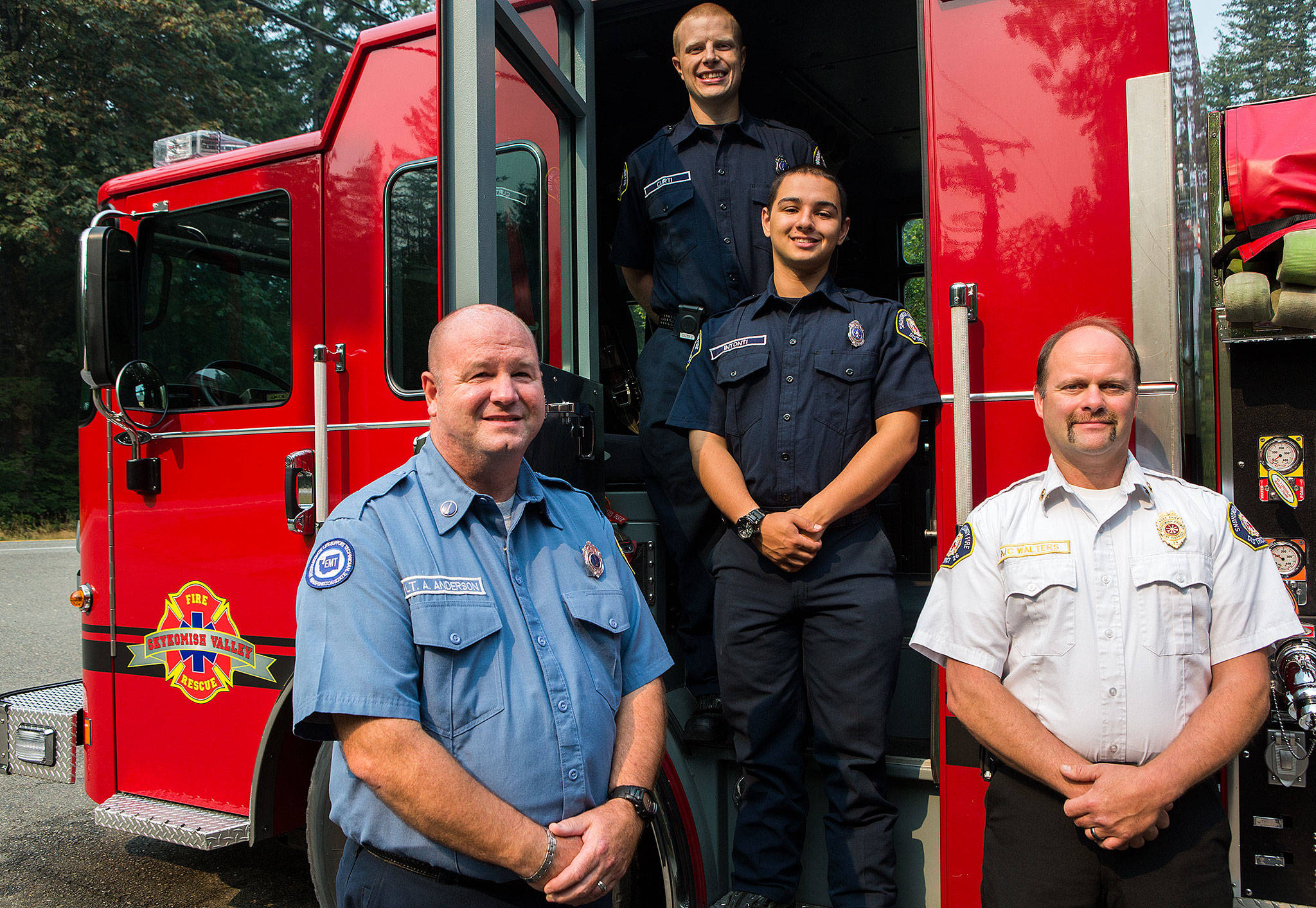 Andrew Anderson (from left), Jacob Curti, Michael Intonti, and Ernie Walters at Snohomish County Fire Station 54 on Wednesday in Gold Bar. (Olivia Vanni / The Herald)