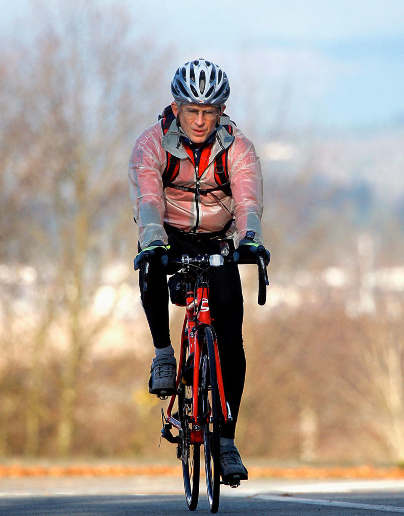 Everett’s board of park commissioners have recommended “Art Grossman Memorial Park” as the name for a new park on Colby Avenue. Grossman, a retired doctor who died in December was an avid cyclist, shown here riding his bike in 2013. (Dan Bates / The Herald)
