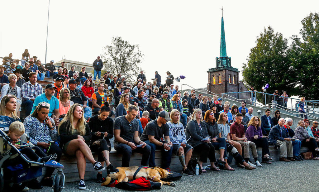 A good-sized crowd attended “A Night to Remember, A Time to Act” at the courthouse plaza. (Dan Bates / The Herald)
