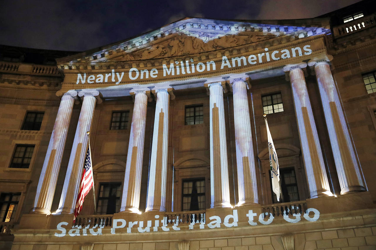 A message is projected on the Environmental Protection Agency on July 23 in Washington. (AP Photo/Alex Brandon)