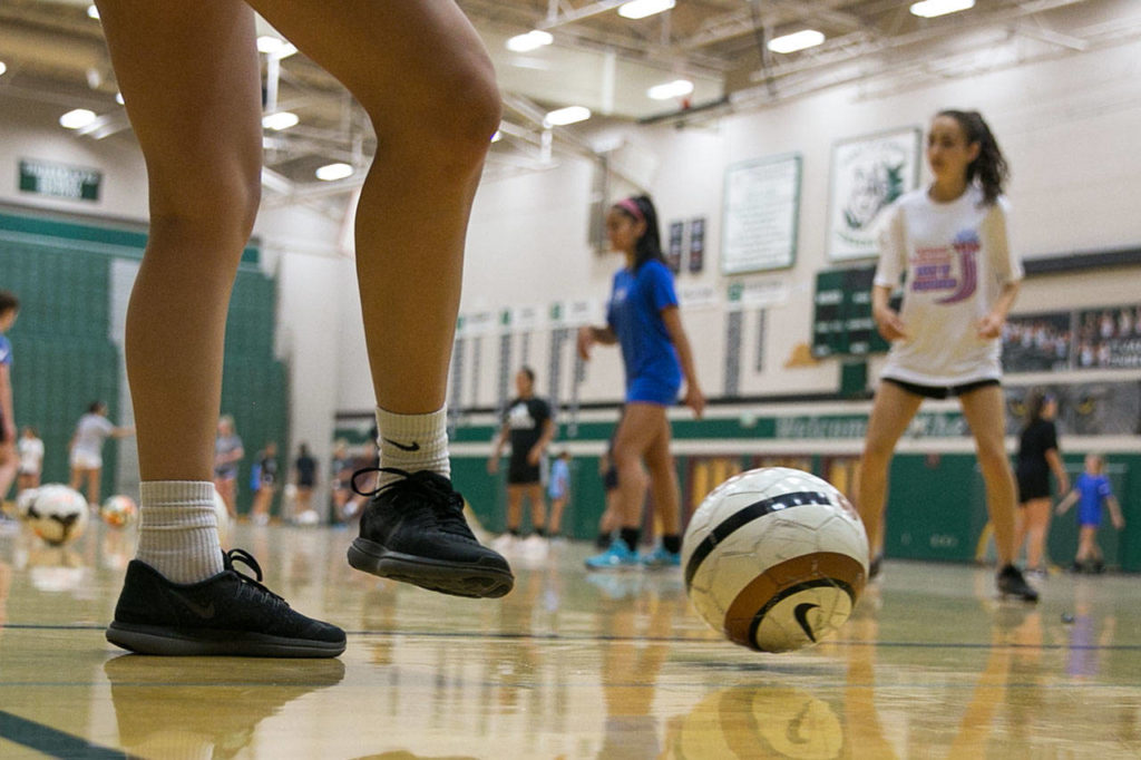 Jackson High School soccer hopefuls try out for the teams in the school gym due to poor air quality in Mill Creek on August 21, 2018. (Kevin Clark / The Herald)
