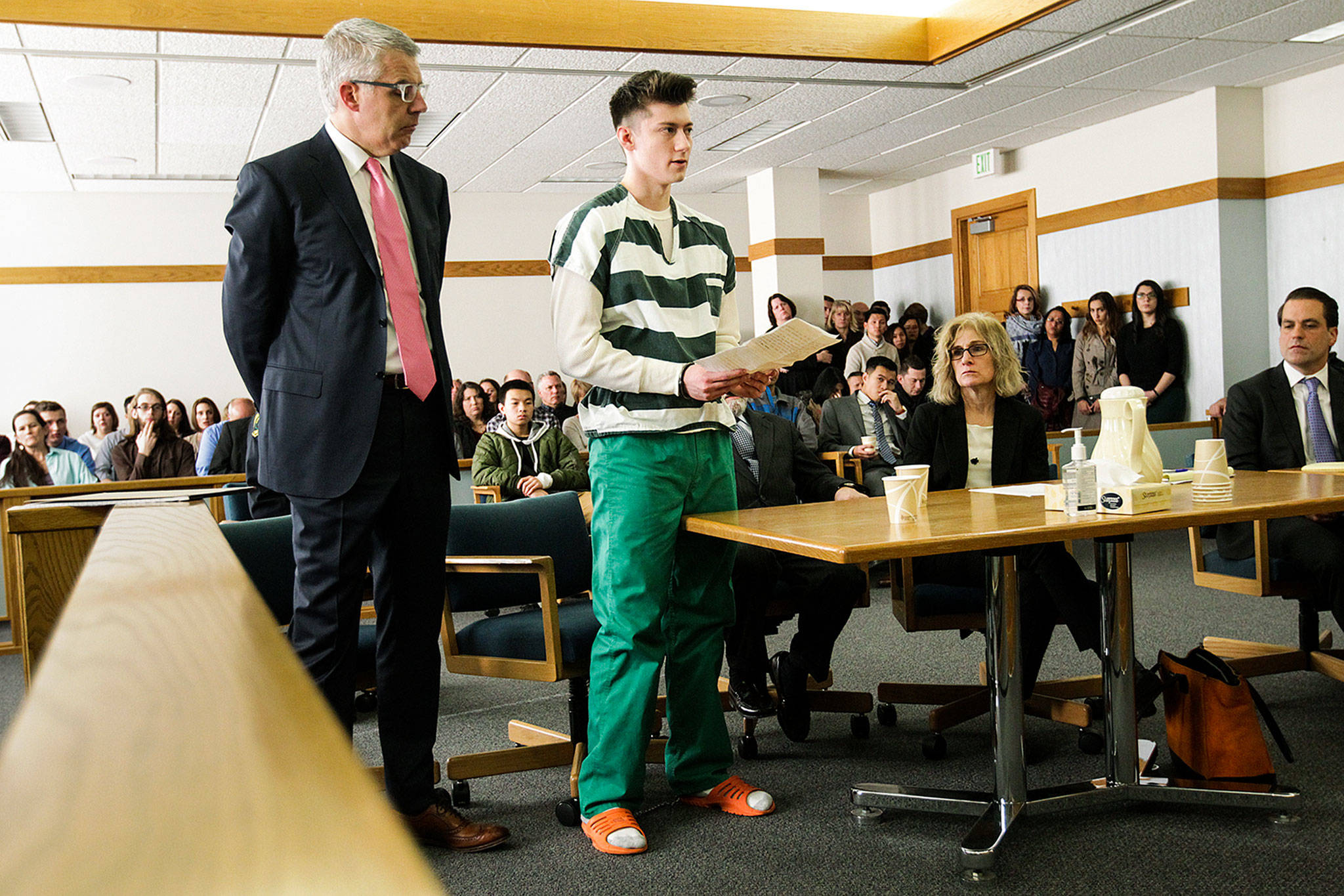 Allen Ivanov reads a statement before being sentenced to life in prison without parole for opening fire and killing three at a house party in Mukilteo in July during a hearing at Snohomish County Superior Court in Everett on Jan. 12. (Ian Terry / Herald file)