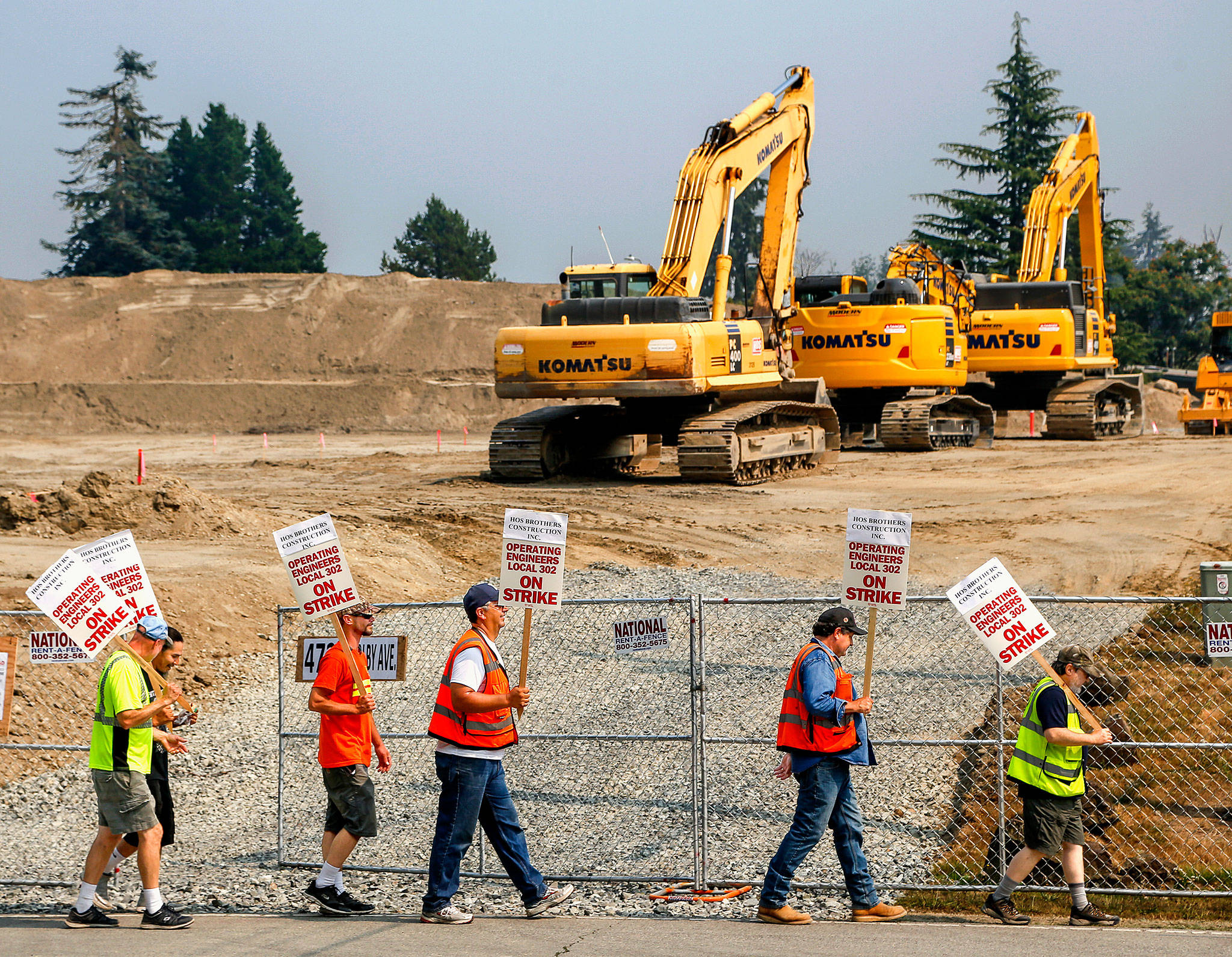 HOS Brothers construction Inc. operating engineers with Local 302 were in their second day of a strike Tuesday, picketing on Rucker Avenue outside the construction site gate for the new Everett YMCA. (Dan Bates / The Herald)