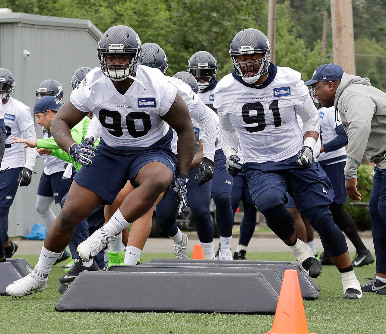 Seattle’s Tom Johnson (91) and Jarran Reed (90) participate in an agility drill during a Seahawks practice on May 24 in Renton. Johnson and Shamar Stephen are both former Minnesota Vikings who have fit in well with the Seahawks. (AP Photo/Ted S. Warren, File)