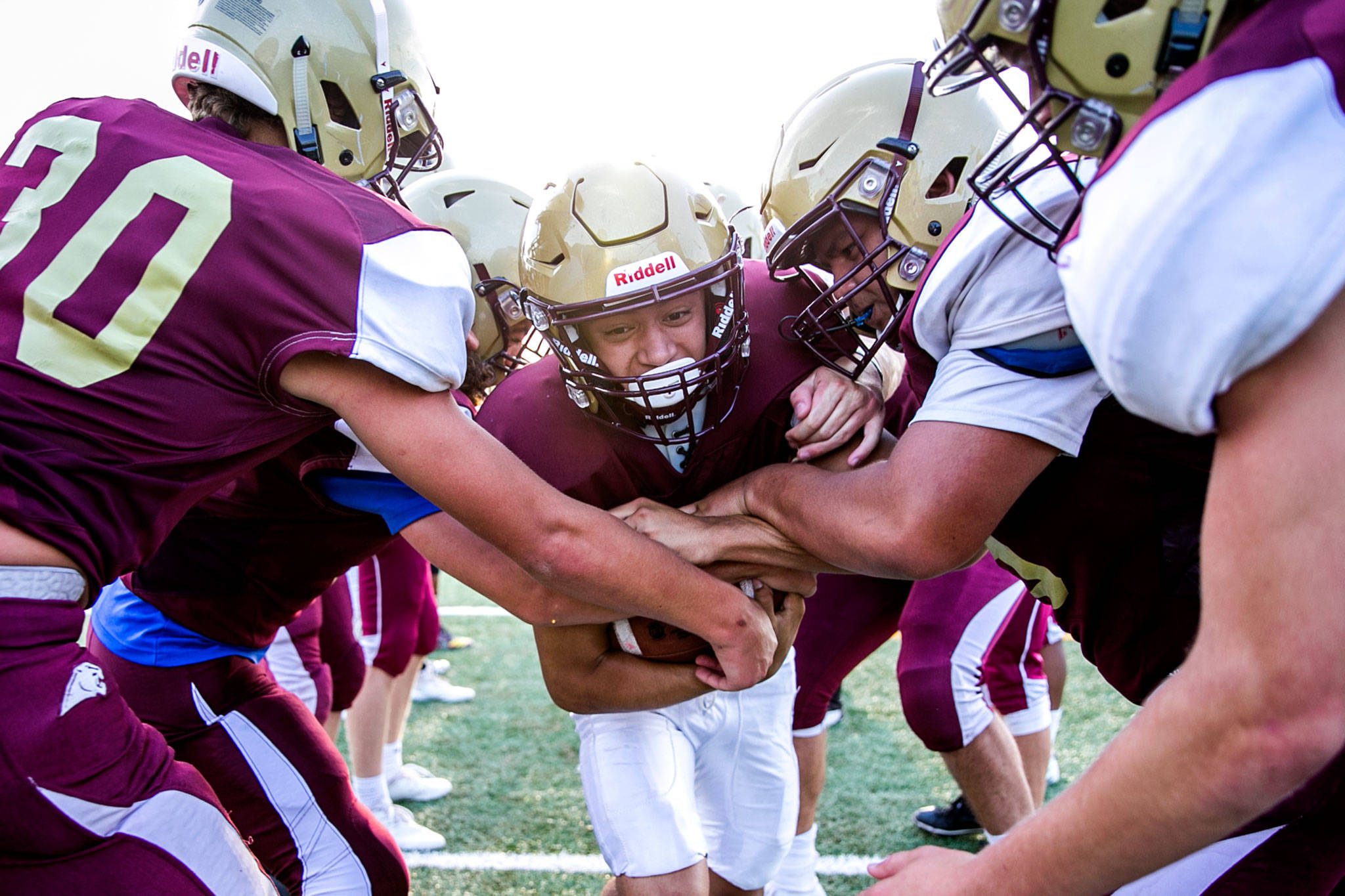 Lakewood running back Landen Pruitt runs through a gauntlet of players during practice on Aug. 23, 2018,at Lakewood High School in Arlington. (Kevin Clark / The Herald)