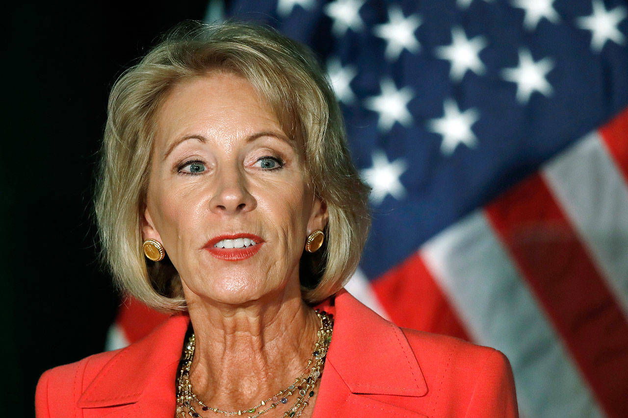 Education Secretary Betsy DeVos speaks at the George Mason University campus in Arlington, Virginia, on Sept. 7. Complaints and lawsuits lodged against for-profit colleges are unfolding as DeVos engineers a seismic shift in the regulatory landscape that stands to benefit the multibillion-dollar industry. (AP Photo/Jacquelyn Martin, File)