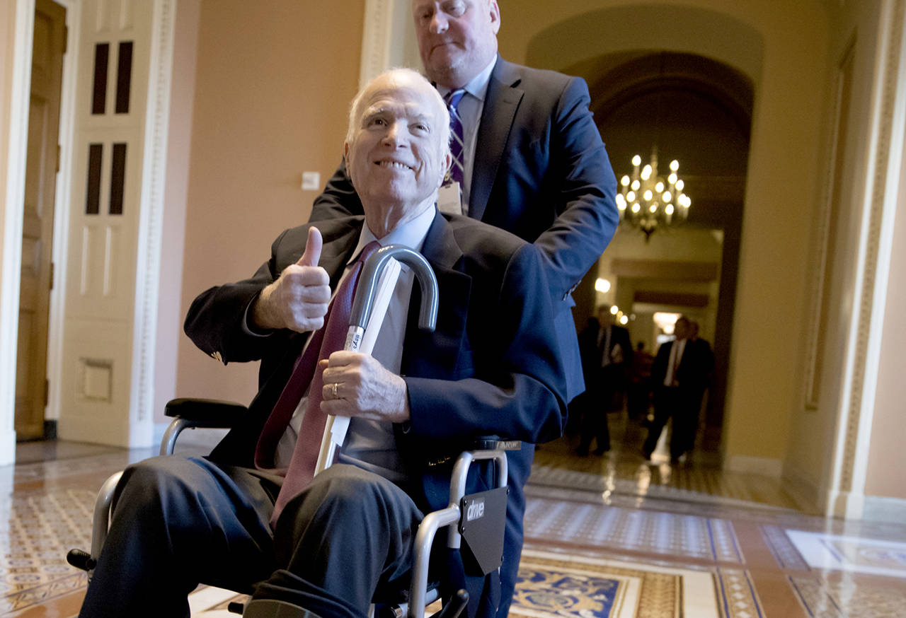 Sen. John McCain leaves a closed-door session last December where Republican senators met on the GOP effort to overhaul the tax code. (AP Photo/J. Scott Applewhite, File)