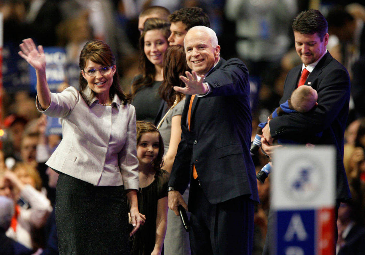 Republican presidential candidate John McCain joins vice presidential candidate Sarah Palin and her family following her speech at the Republican National Convention in St. Paul, Minn, Sept. 3, 2008. (Charlie Neibergall / Associated Press file photo)