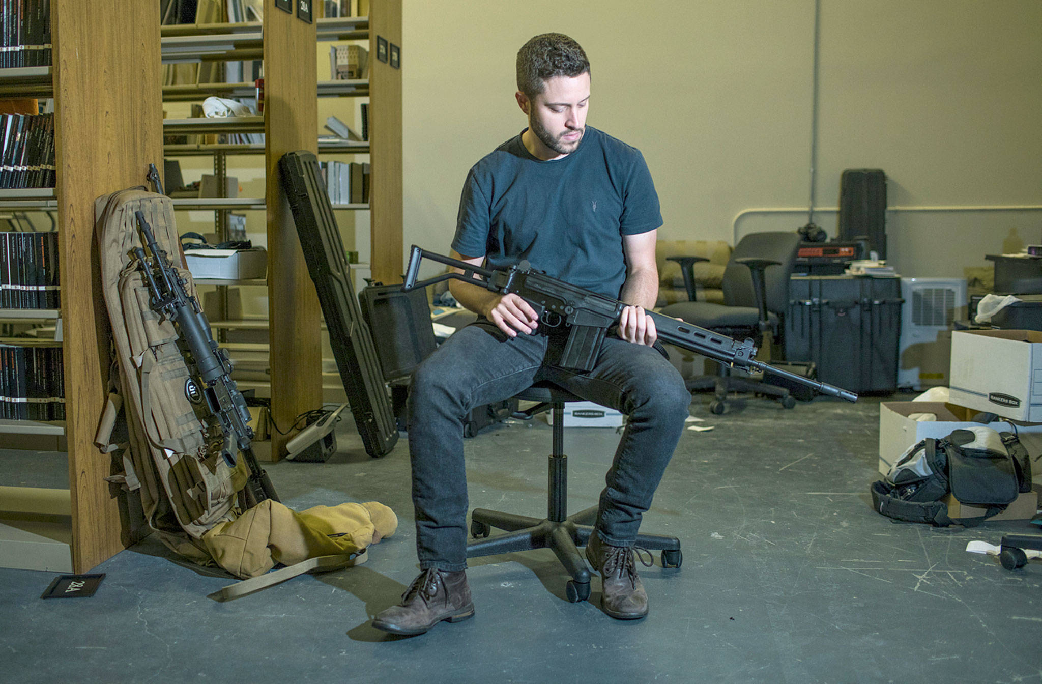 Cody Wilson, director of Defense Distributed, in his library behind the company’s factory in Austin, Texas. (Tamir Kalifa for The Washington Post)