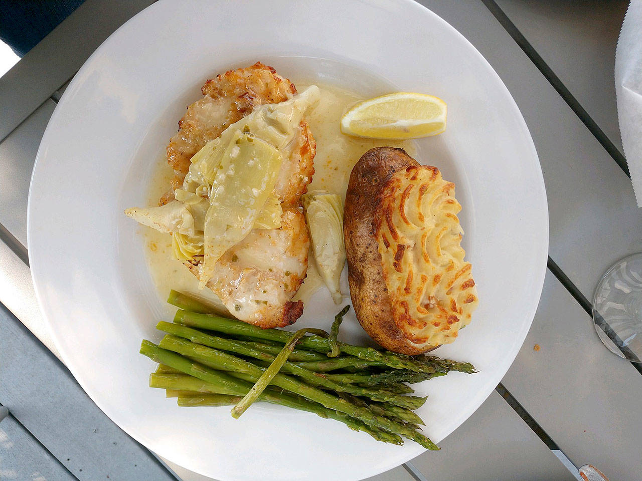 Chicken limon with twice-baked potato and asparagus at Francisco’s Kitchen & Cantina in Lake Stevens. (Sara Bruestle / The Herald)