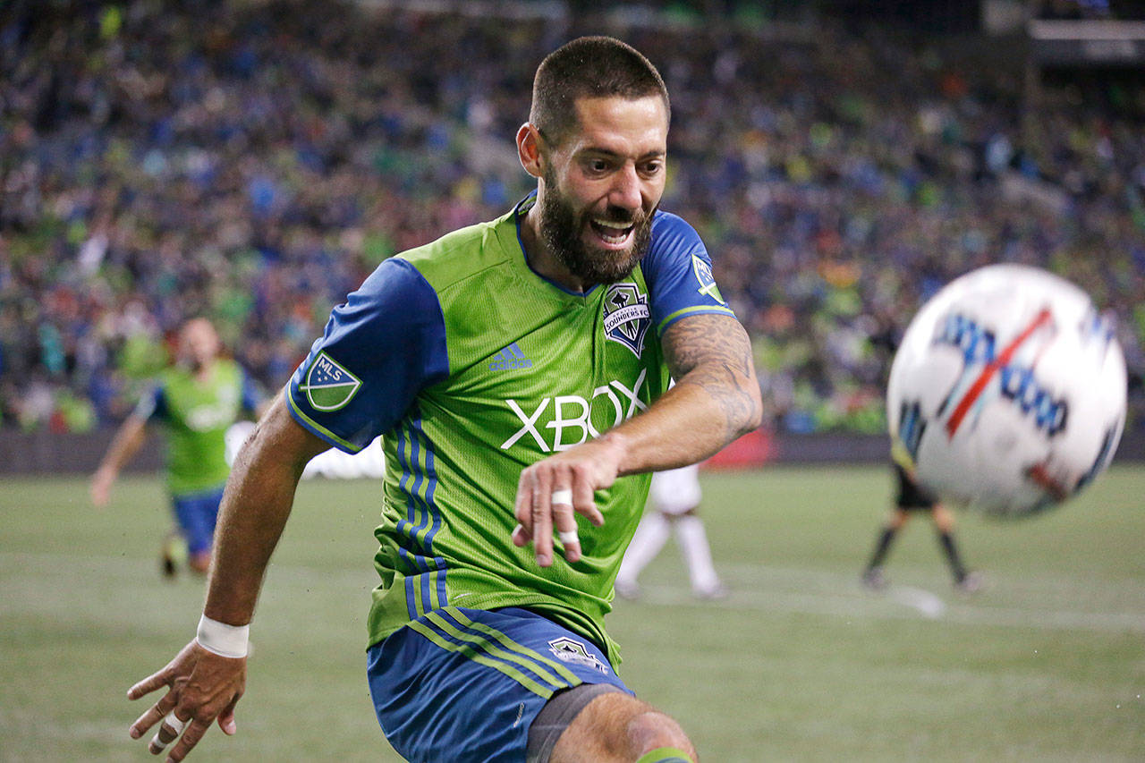 Clint Dempsey of the Seattle Sounders smiles as he kicks a ball into the stands after scoring the second of his two goals against the Vancouver Whitecaps on Nov. 2, 2017, in Seattle. (AP Photo/Elaine Thompson)