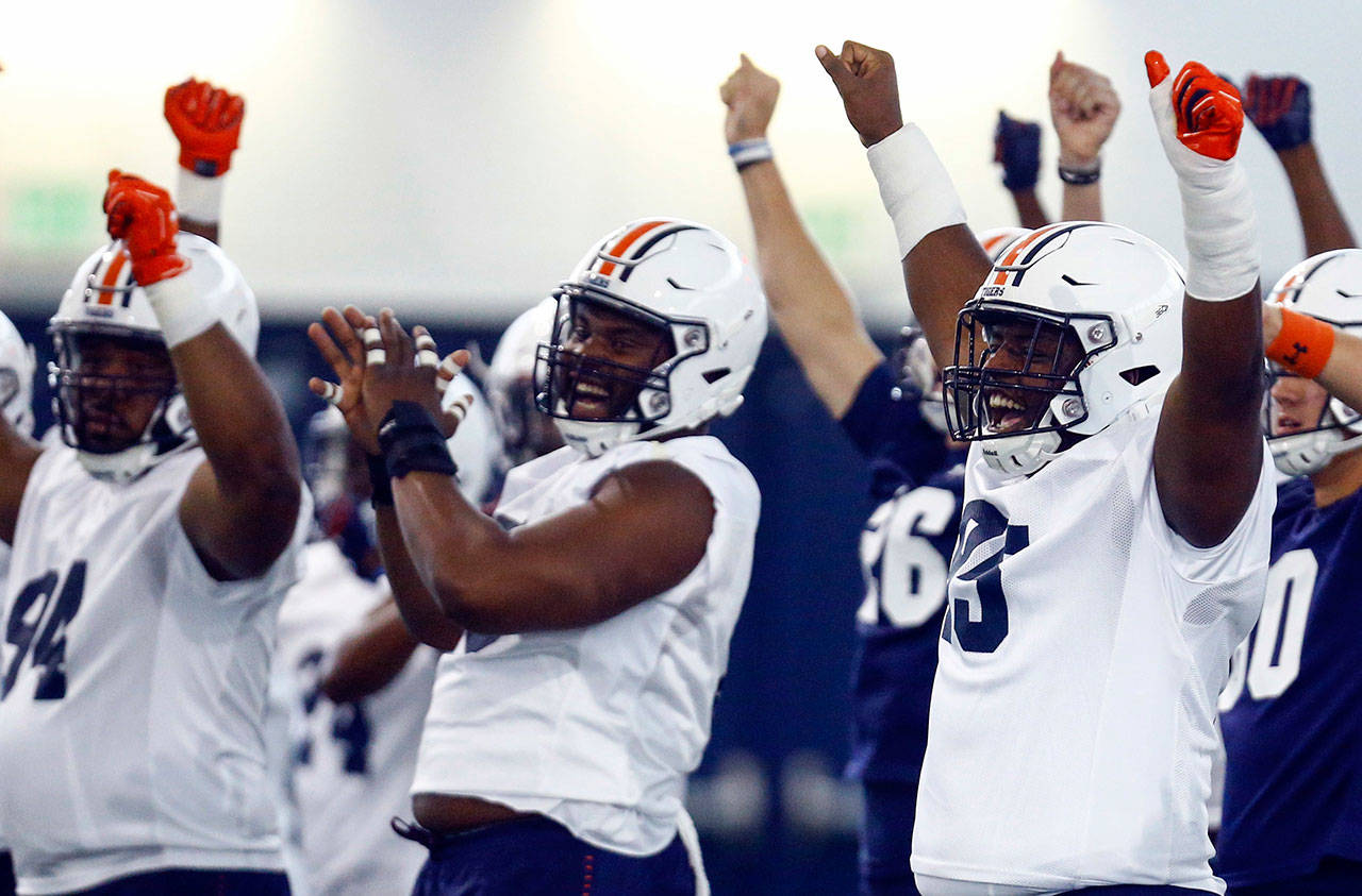 Auburn players reacts during a practice on Aug. 3, 2018, in Auburn, Ala. (AP Photo/Butch Dill)