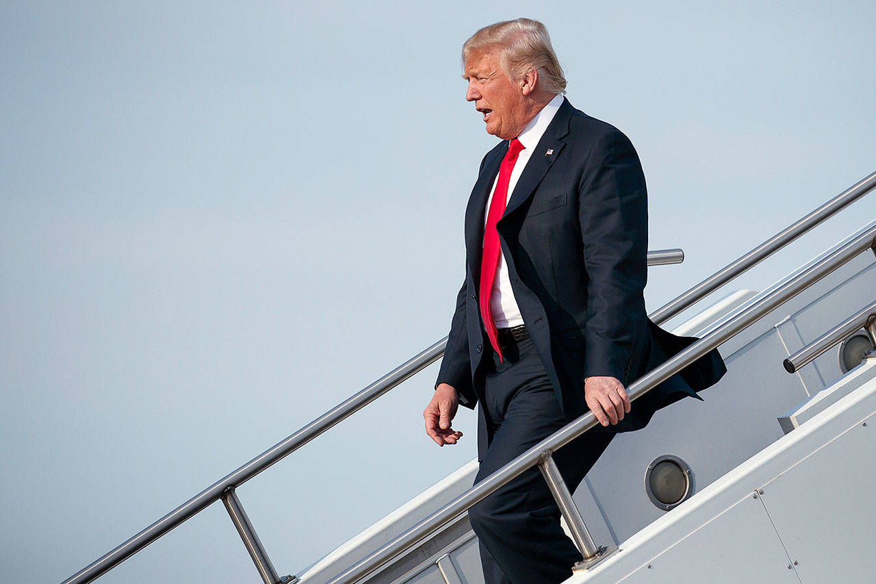 President Donald Trump walks off Air Force One after arriving at Evansville Regional Airport on Thursday in Evansville, Indiana. (AP Photo/Evan Vucci)