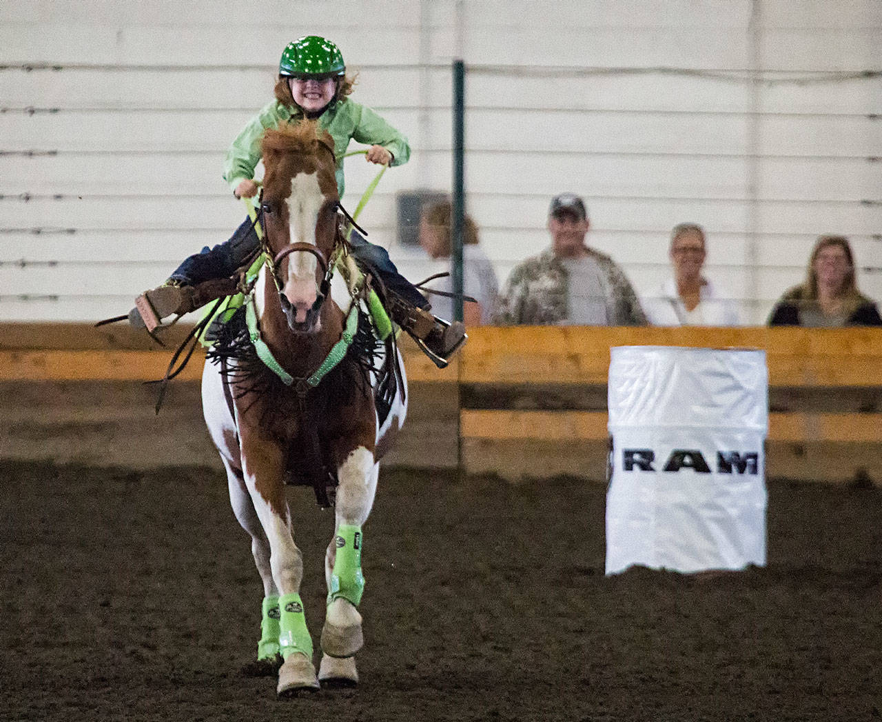 Teagan Petersen, 6, spurs her horse on to the finish line during barrel racing on the last day of Evergreen State Fair on Monday in Monroe. (Andy Bronson / The Herald)                                 Teagan Petersen, 6, spurs her horse on to the finish line during barrel racing on the last day of Evergreen State Fair on Monday in Monroe. (Andy Bronson / The Herald)
