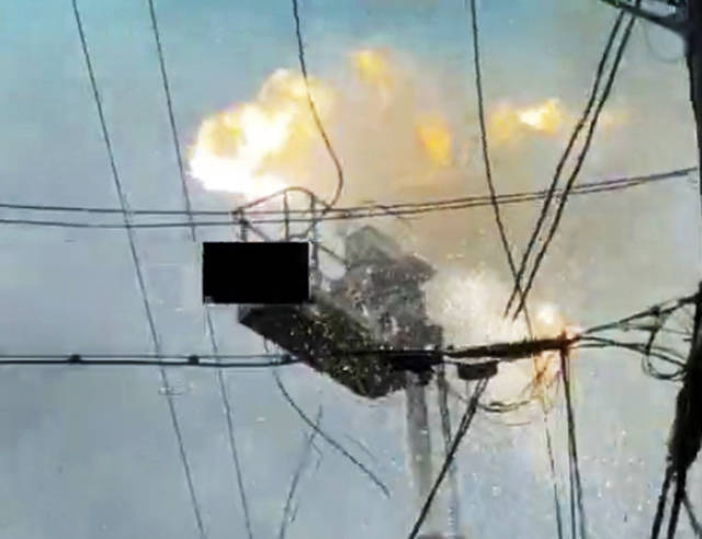 An image from cellphone video taken by a bystander when a hydraulic lift hit electrical wires in Everett. (Everett Police Department)