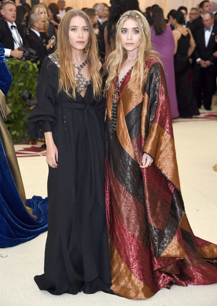 Mary-Kate Olsen, left, and Ashley Olsen attend The Metropolitan Museum of Art’s Costume Institute benefit gala celebrating the opening of the “Heavenly Bodies: Fashion and the Catholic Imagination” exhibition on May 7 in New York. (Evan Agostini/Invision)
