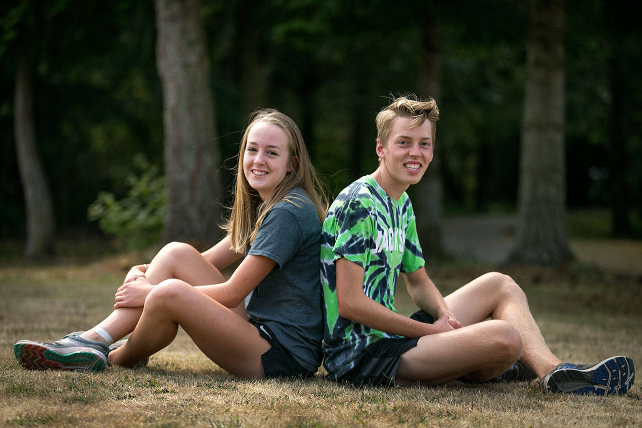 Siblings Anna, junior, and Joseph, senior, Skoog of Jackson High School are both solid distance runners, Anna placed 12th at last year’s 4A state meet and Joseph 41st. (Kevin Clark / The Herald)