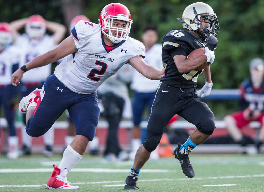 Lynnwood’s Zayn Alrobae escapes a tackle during Fridays game against Nathan Hale on Aug. 31, 2018 in Edmonds, Wa. (Olivia Vanni / The Herald)
