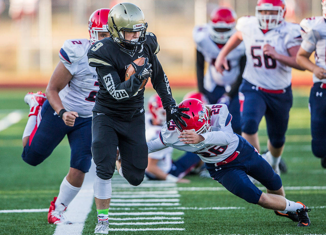 Lynnwood’s Nate Killen escapes multiple tackles for a touchdown during Fridays game against Nathan Hale on Aug. 31, 2018 in Edmonds, Wa. (Olivia Vanni / The Herald)