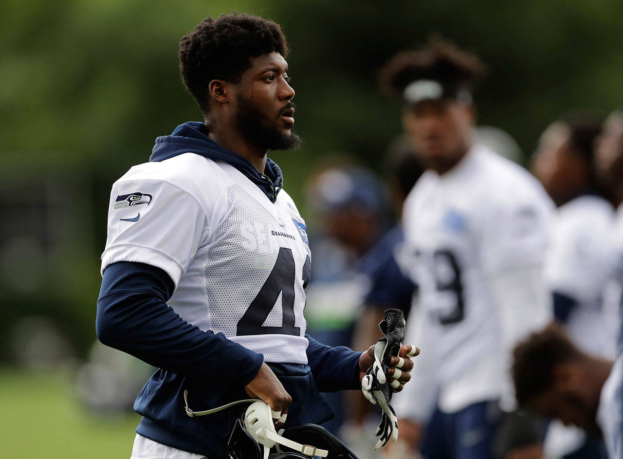 The Seahawks placed defensive back Byron Maxwell (left) on injured reserve, ending his season on Saturday. (AP Photo/Ted S. Warren)