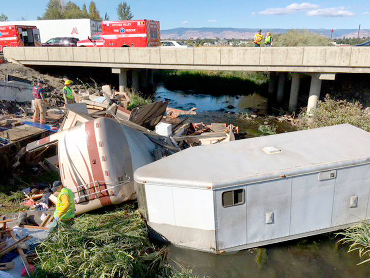 A woman and child from Snohomish County died after this motorhome, which was pulling a trailer, crashed along I-90 near Ellensburg on Monday. (Washington State Patrol)