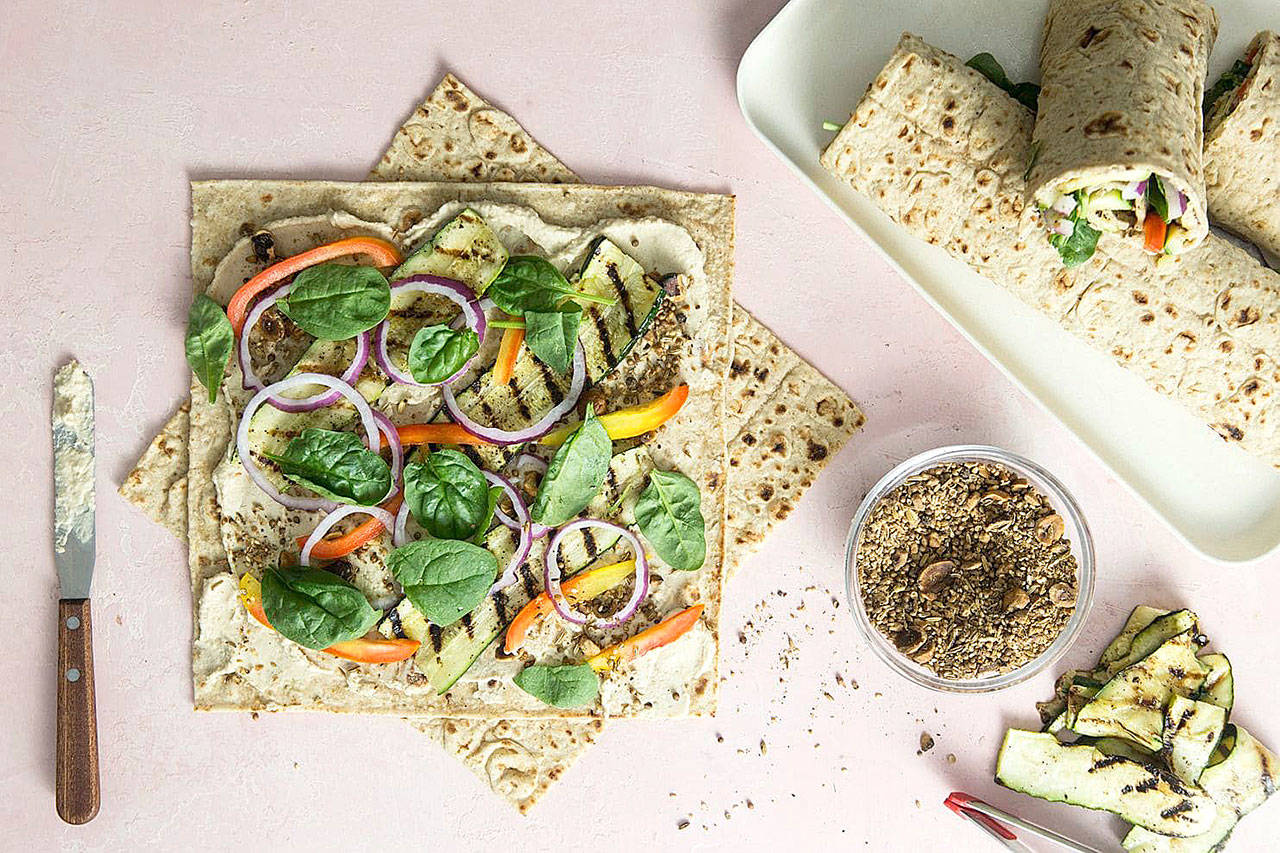 Grilled zucchini and dukkah take hummus wraps from boring to absolutely crave-worthy. (Jennifer Chase/For The Washington Post)