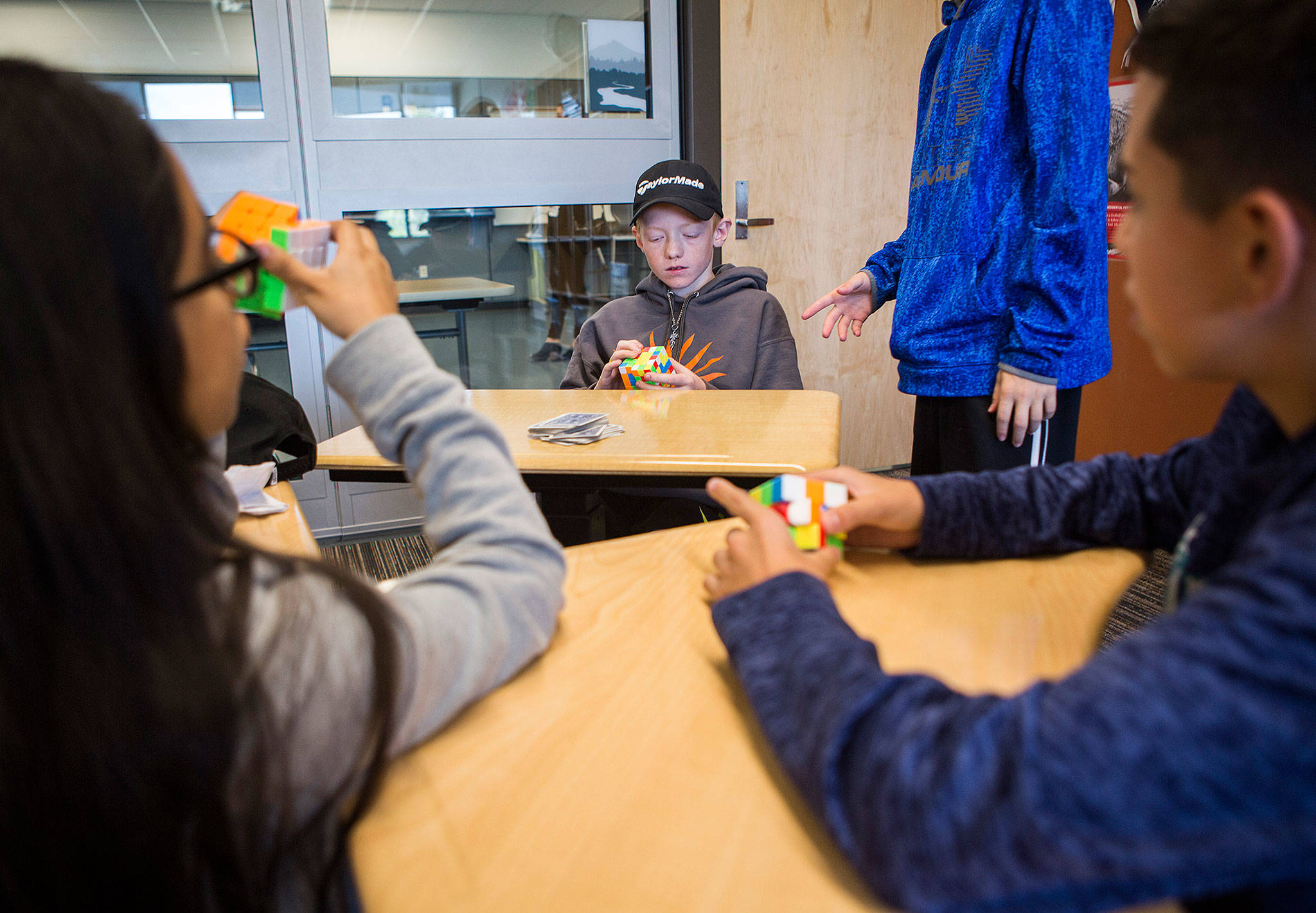 Ashton Dominick, 13, plays with a Rubik’s cube during school at Park Place Middle School on Thursday in Monroe. (Olivia Vanni / The Herald)