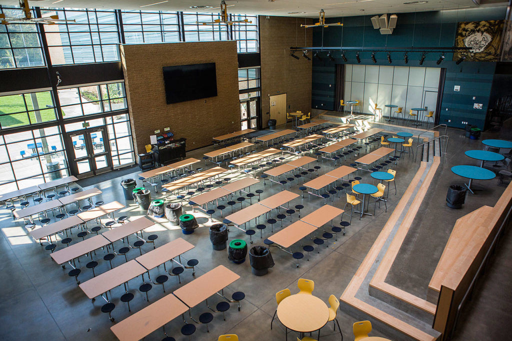 The new lunch area with a stage and multi-screen televisions at Park Place Middle School on Thursday in Monroe. (Olivia Vanni / The Herald)
