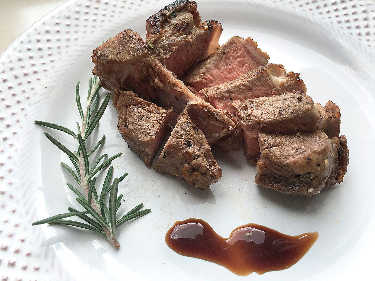 Marinate lamb loin chops in garlic, rosemary and thyme before grilling. (Susan Selasky/Detroit Free Press)
