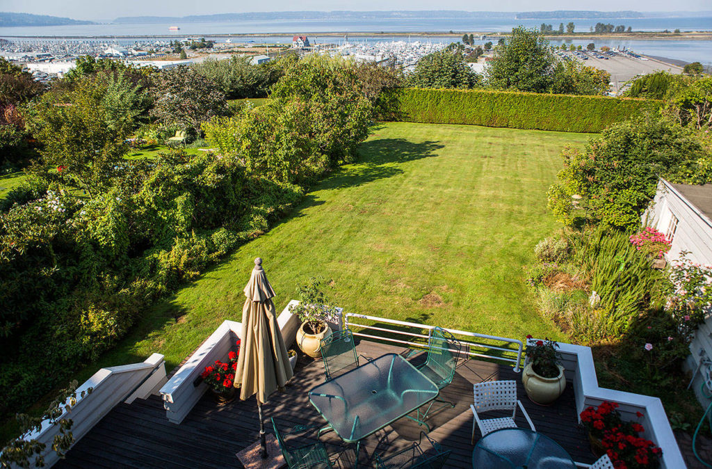 A large yard with a two-level deck at Marlies Egberding and Ritch Sorgen’s home Sept. 5 in Everett. (Olivia Vanni / The Herald)

