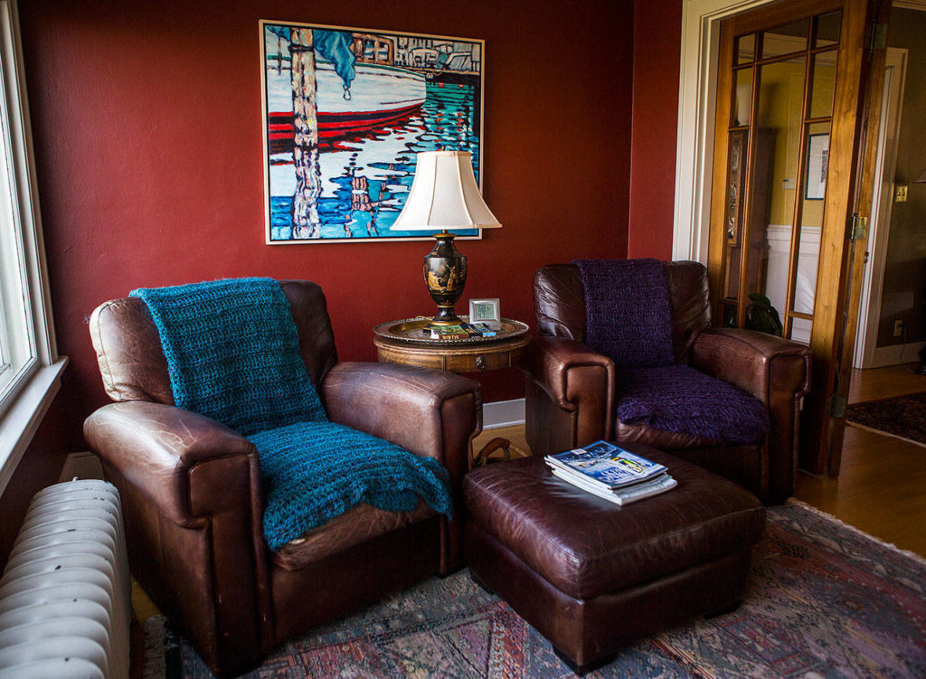 Two large leather chairs in a sitting room at Marlies Egberding and Ritch Sorgen’s home on Sept. 5 in Everett. (Olivia Vanni / The Herald)
