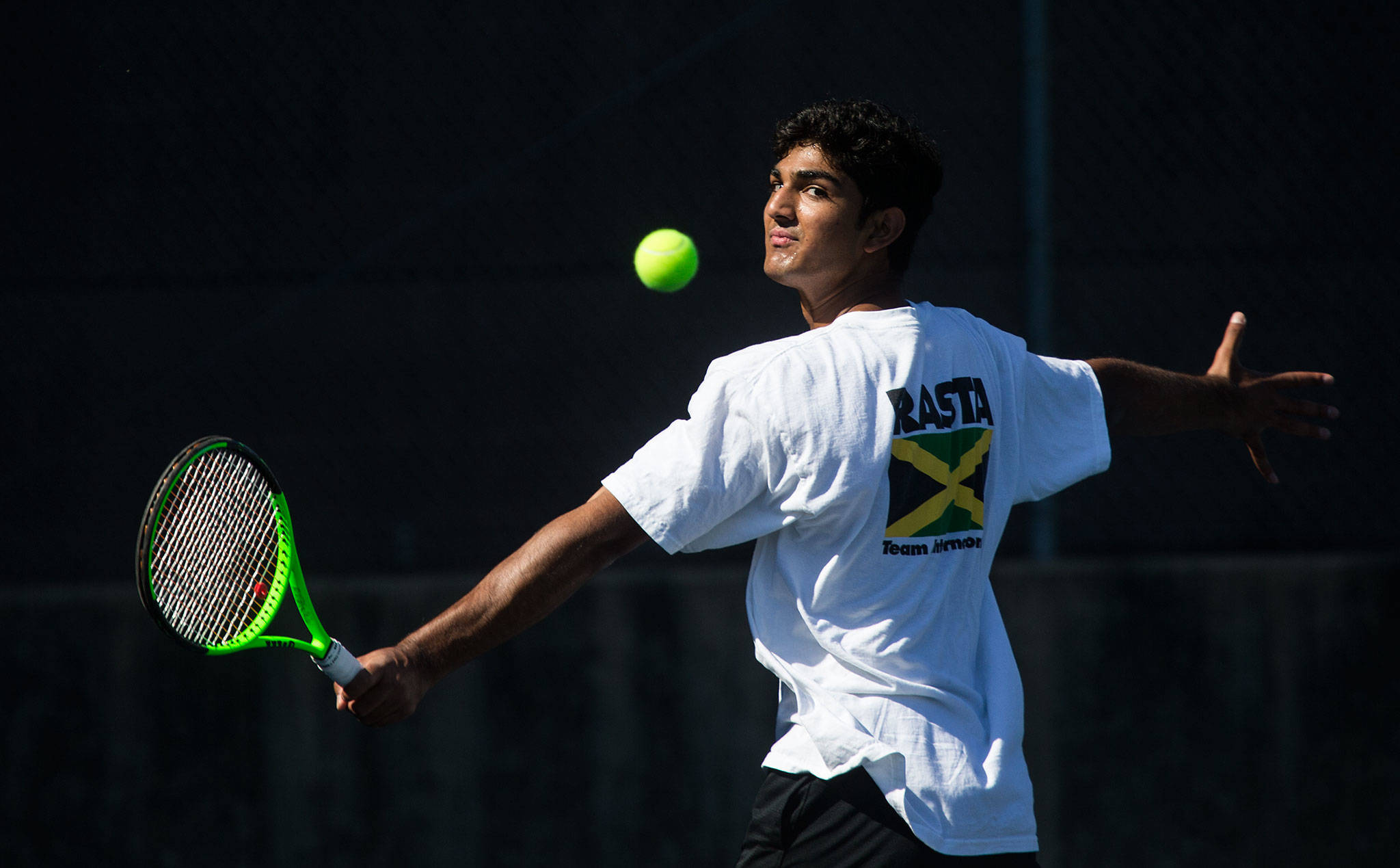 Jackson senior Anuj Vimawala watches the ball on a backhand shot during practice on Aug. 27 in Everett. Vimawala is one of the top returning tennis players in the area this season. (Andy Bronson / The Herald)