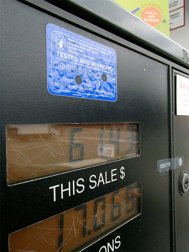 A sticker shows the state Department of Agriculture’s Weights and Measures program last inspected this Everett gas pump in October 2011. The agency confirmed the pump hasn’t been inspected since at least 2014. Inspections are dwindling because of budget cuts, agency staff say. (Herald photo)