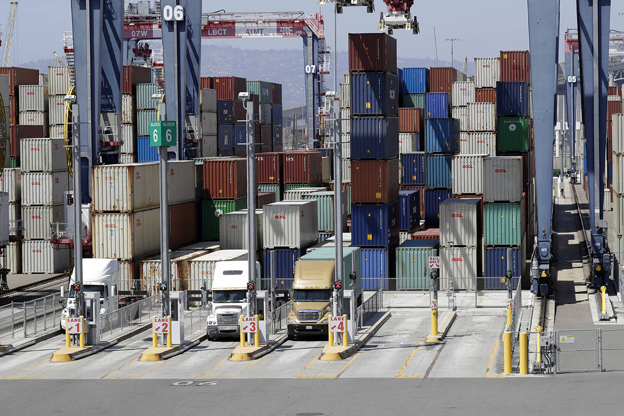 In this Aug. 22 photo, cargo is unload from trucks at the Port of Long Beach in Long Beach, California. (AP Photo/Marcio Jose Sanchez, File)