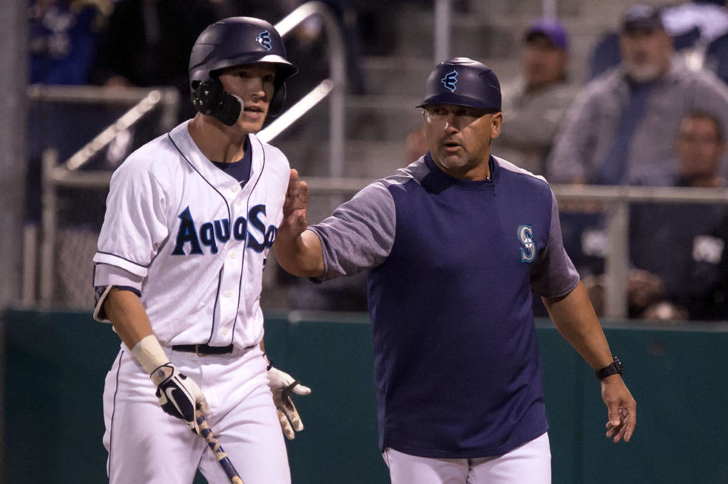 The AquaSox’s Ryan Ramiz protest a call with manager Jose Moreno intervening during Game 1 of the Northwest League North Division Championship Series against Spokane on Sept. 5, 2018, at Everett Memorial Stadium . (Kevin Clark / The Herald)
