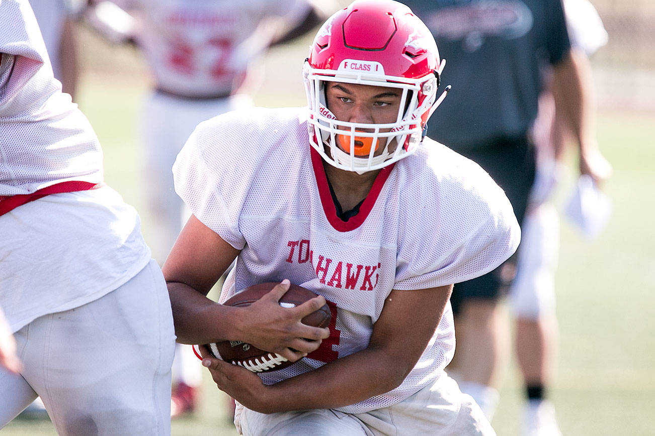 Trenton Hurst rushes for yardage Thursday afternoon during practice at Quil Ceda Stadium in Marysville on September 6, 2018. (Kevin Clark / The Herald)