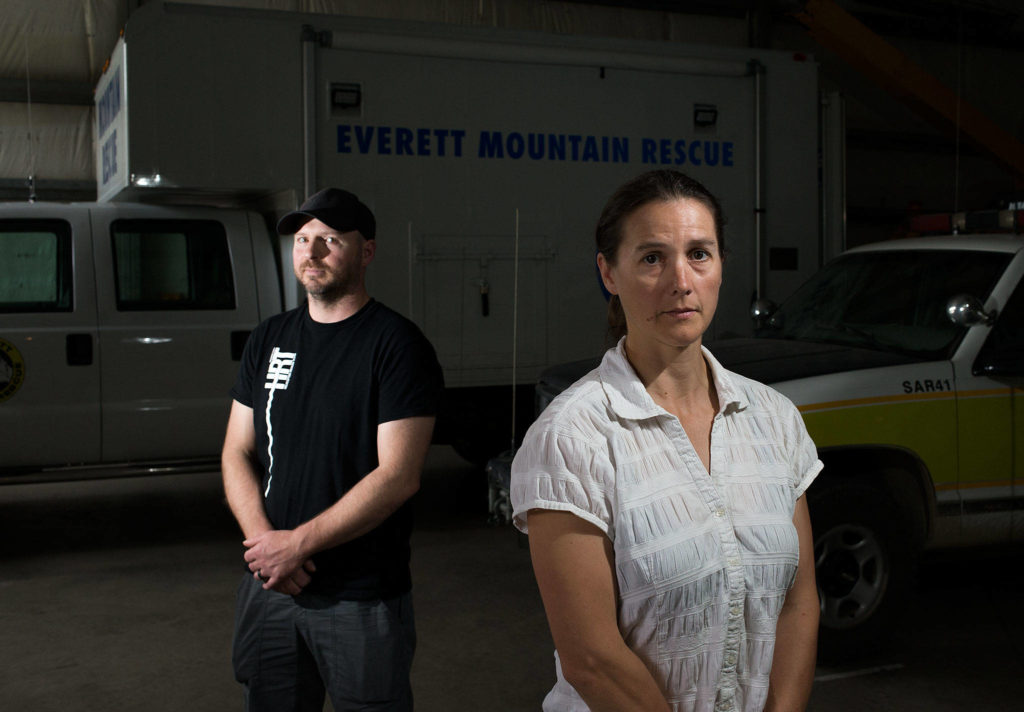 Everett Mountain Rescue volunteers Joe Edmark and Elaina Jorgensen talk about their experiences searching for Sam Sayers, missing on Vesper Peak, on Friday, Sept. 7, in Snohomish. (Andy Bronson / The Herald)
